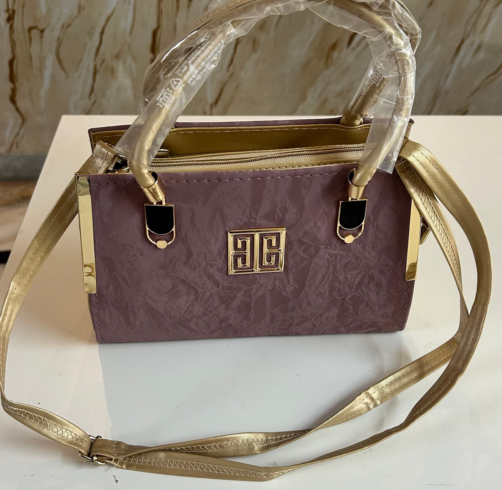 Light violet colour fancy hand bag